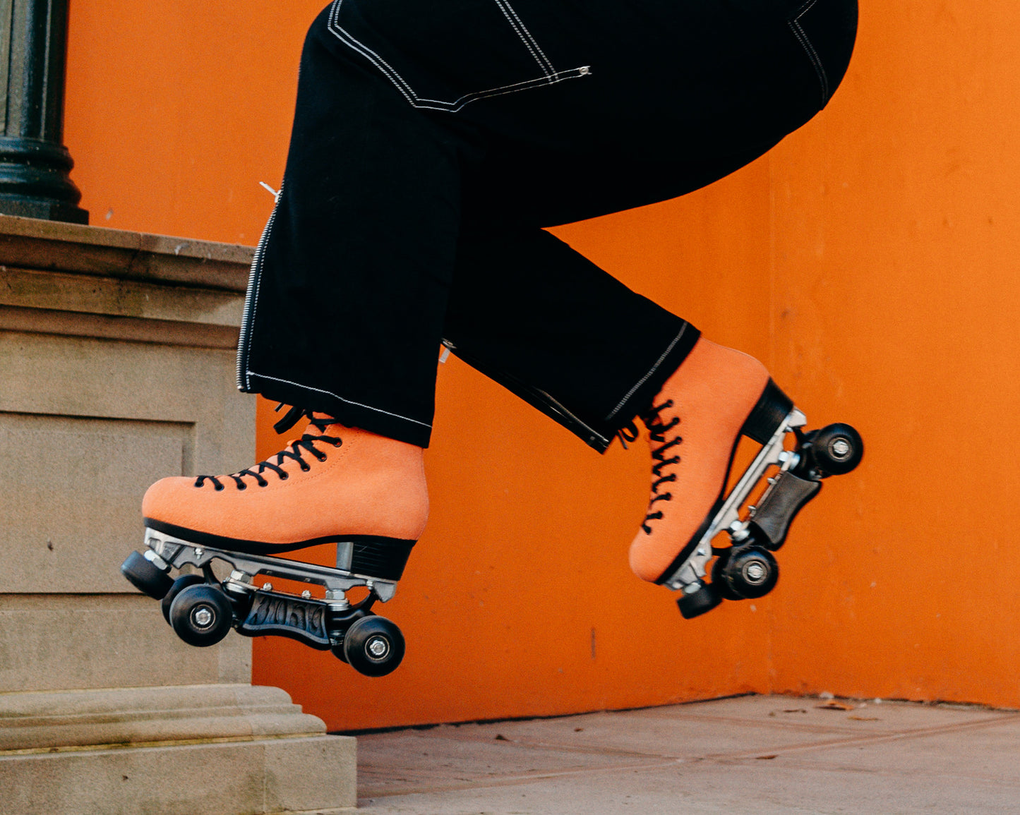 Orange Pro Boot rollerskate, jumping on skates